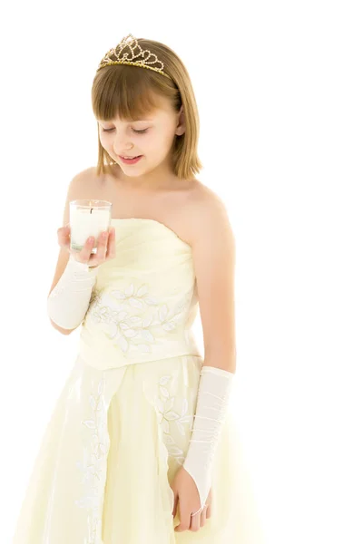 Little girl in a New Year costume with a candle. — Stock Photo, Image