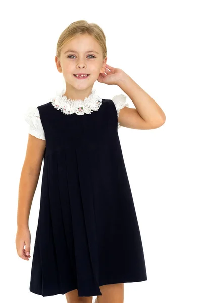 Adorável sorrindo menina posando em uniforme escolar — Fotografia de Stock