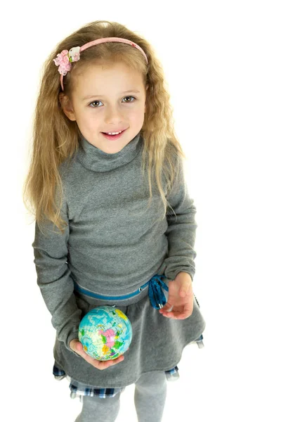 Cute girl holding small globe in her hands — Stock Photo, Image