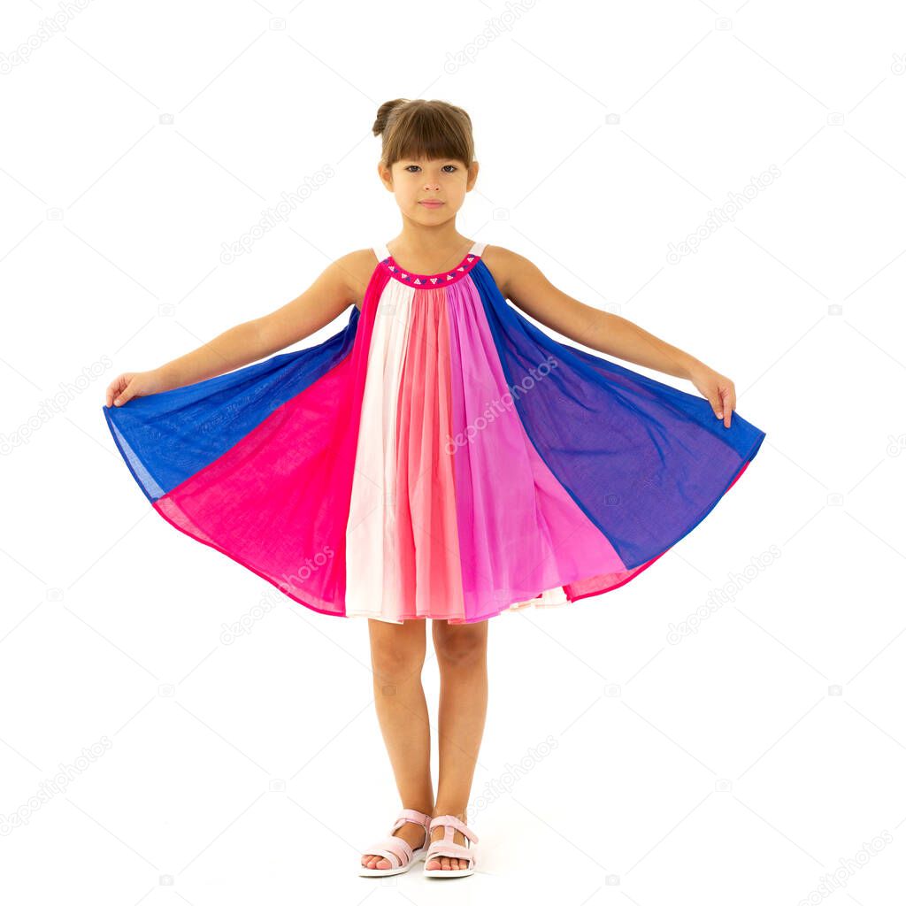 Full length shot of happy girl in fluttering dress
