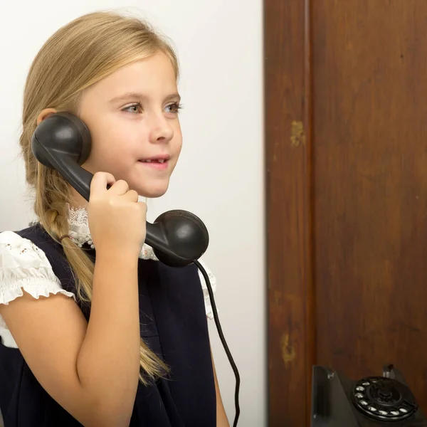 Cute girl speaking via vintage phon — Stock Photo, Image