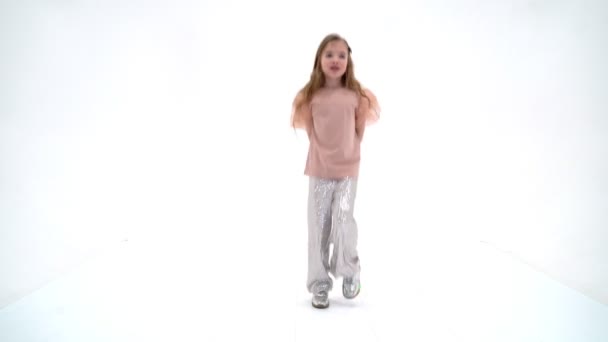 A cheerful little girl is dancing.The concept of a school of dance. — Stock Video
