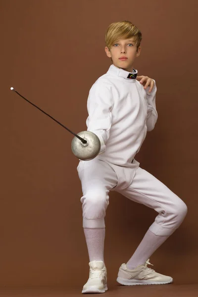 Boy fencer standing in attacking pose — Stock Photo, Image