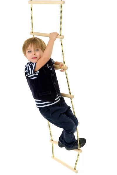 Cute little boy climbing rope ladder — Stock Photo, Image