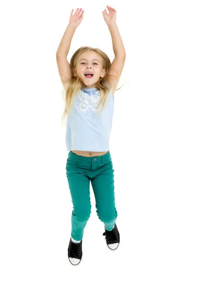 Happy girl jumping with raising hands — Stock Photo, Image