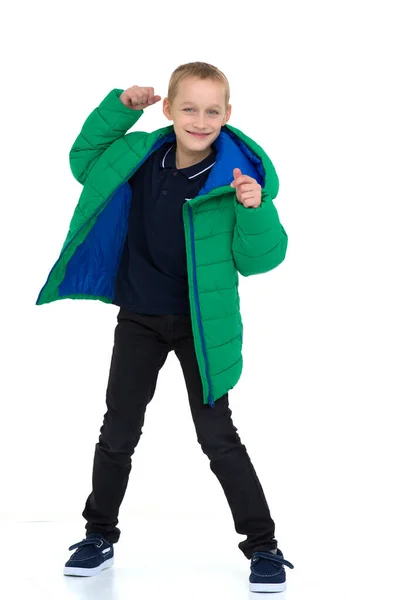 Smiling boy in unbuttoned green winter jacket — Stock Photo, Image