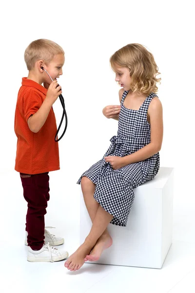 Cute children playing doctor and patient Royalty Free Stock Photos