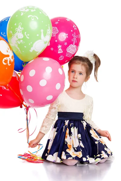 Mooi meisje met kleurrijke ballonnen — Stockfoto