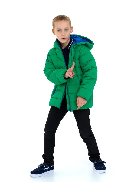 Smiling boy in unbuttoned green winter jacket — Stock Photo, Image