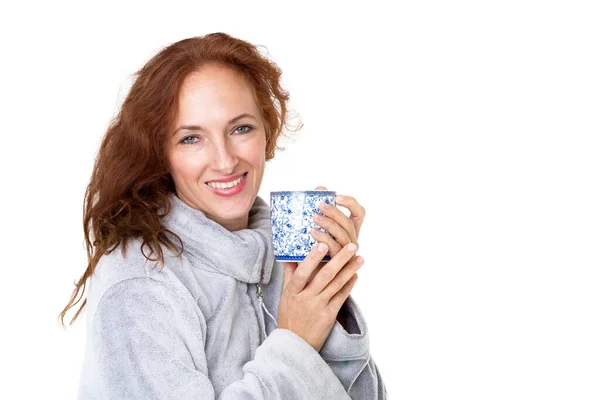 Smiling woman holding porcelain mug — Stock Photo, Image