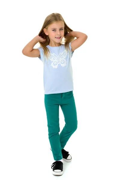 Cute little girl in t-shirt and jeans — Stock Photo, Image