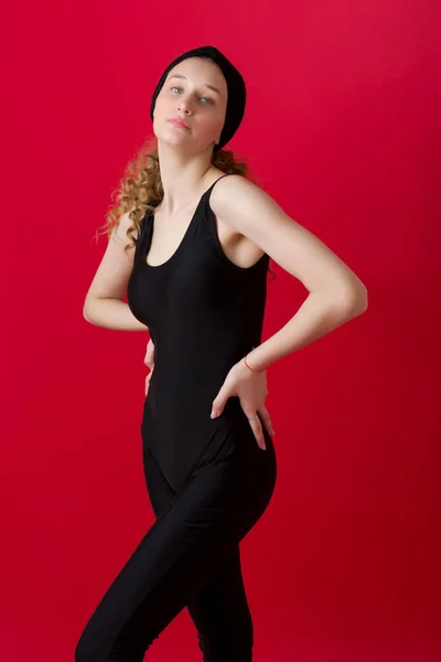 Beautiful girl in sports outfit posing in studio Stock Picture