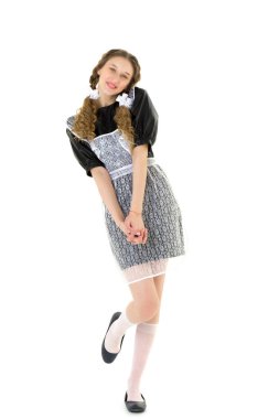 SSCB tarzı okul üniformalı güzel, mutlu bir kız.