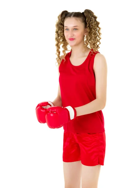 Tonåring blond flicka slåss i röda boxningshandskar — Stockfoto