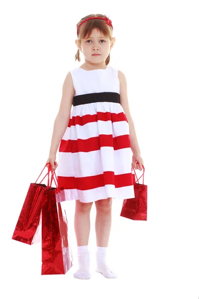 Girl in a striped dress — Stock Photo, Image