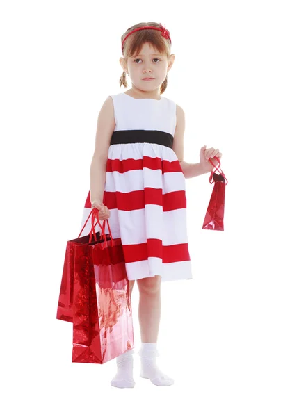 Tired girl with shopping bags — Stock Photo, Image