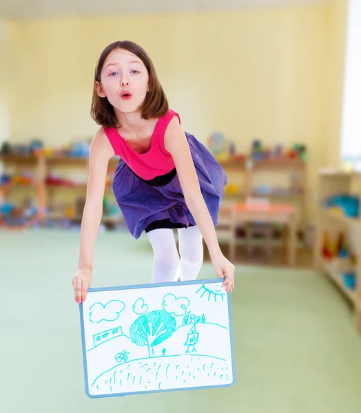 Cheerful girl shows her painted picture. — Stock Photo, Image