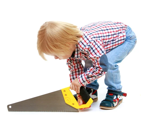 Little boy sawing saw. — Stock Photo, Image