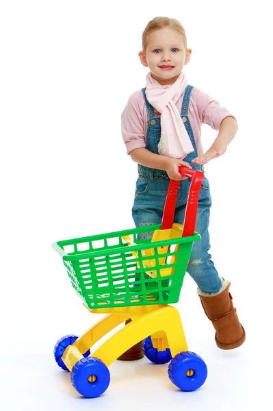 Menina encantadora com um caminhão de brinquedo . — Fotografia de Stock