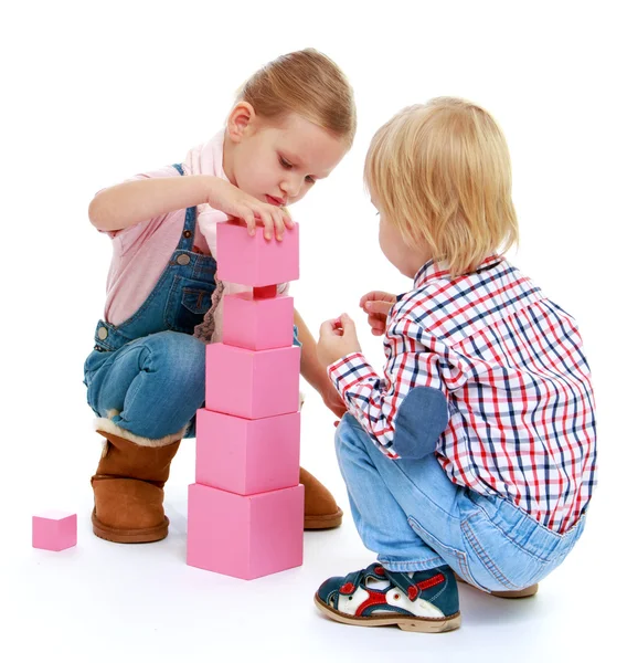 Children playing with blocks. Stock Photo