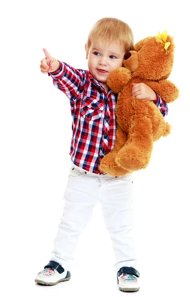 Little boy hugging a teddy bear. — Stock Photo, Image