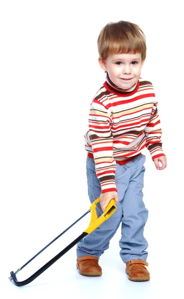 Little boy holding a hacksaw. — Stock Photo, Image