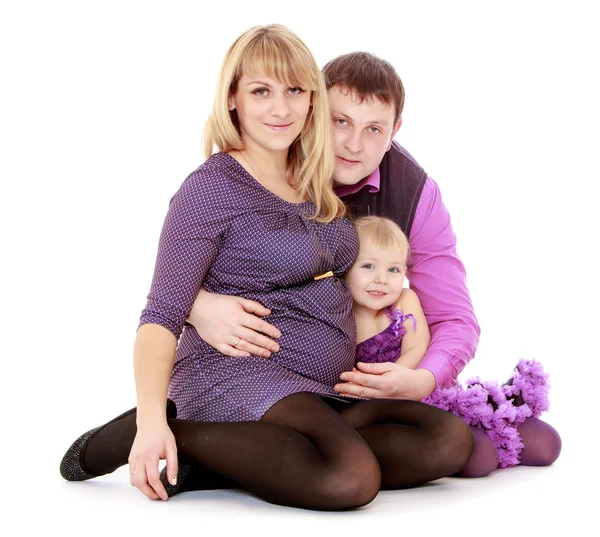 Happy young mother with a tummy into the arms of his beloved fam — Stock Photo, Image