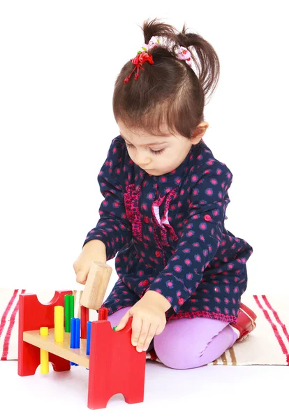 Very busy little girl hammering. — Stock Photo, Image