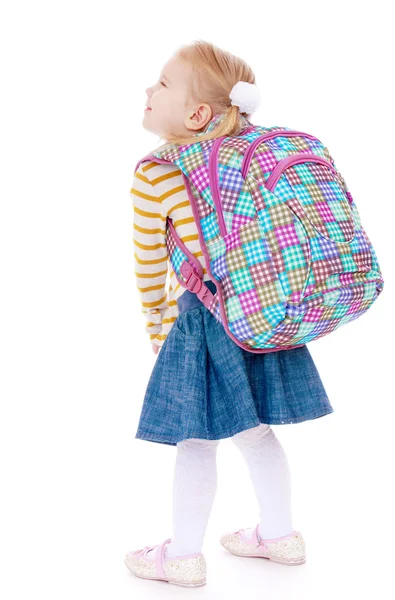 Pretty girl schoolgirl with satchel on his shoulders. — Stock Photo, Image