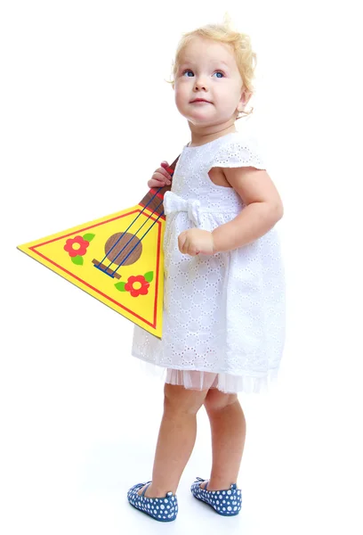 Adorável menina segurando um instrumento folclórico russo balalaika — Fotografia de Stock