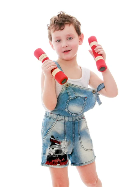 Ragazzino con un manubrio in mano . — Foto Stock