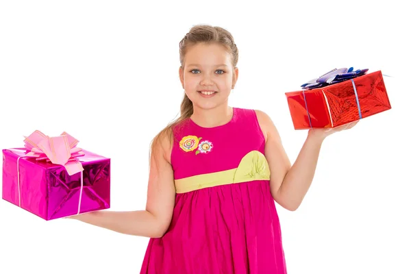 Beautiful caucasian girl holding a beautifully packaged gifts — Stock Photo, Image