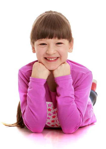 Laughing girl lying on the floor — Stock Photo, Image