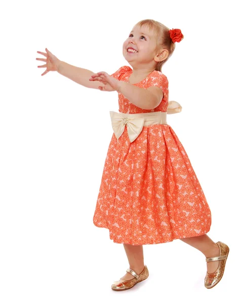 Cheerful little girl runs arms spread wide — Stock Photo, Image