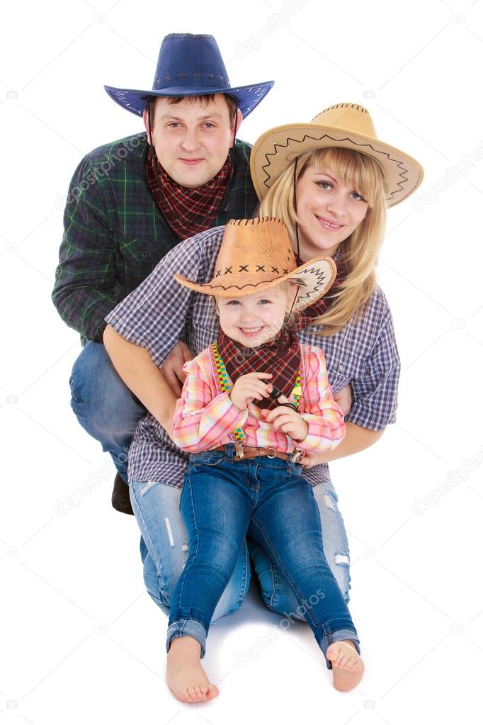 Young family of three persons in the stylish American cowboy cos