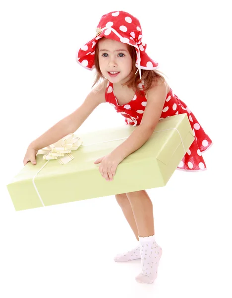 Elegant little girl with a great gift in the hands of — Stock Photo, Image