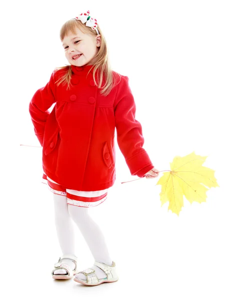 Elegant fashionable girl in a bright red coat — Stock Photo, Image