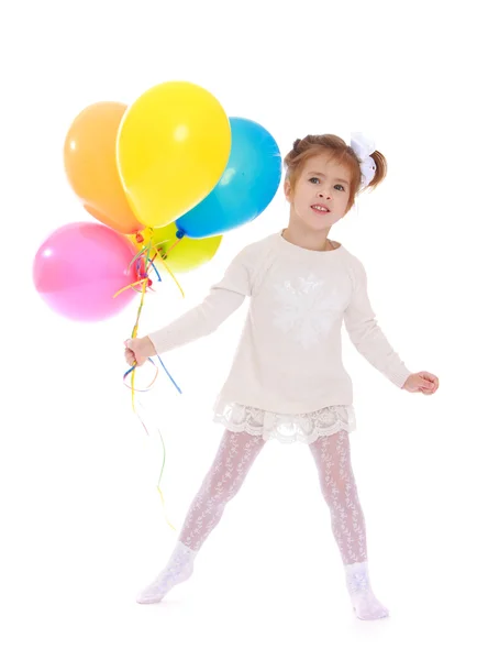 Linda y hermosa chica sosteniendo globos de colores — Foto de Stock