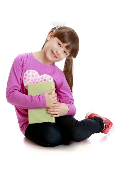 Smiling girl with book — Stock Photo, Image