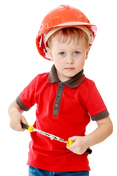 Kleine jongen met hulpprogramma's in de hand. — Stockfoto