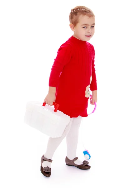 Cute little girl with medical briefcase in his hand — Stock Photo, Image