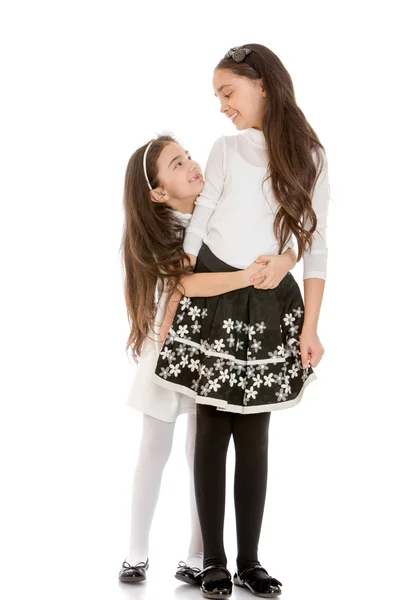 Younger and older sister hugging — Stock Photo, Image