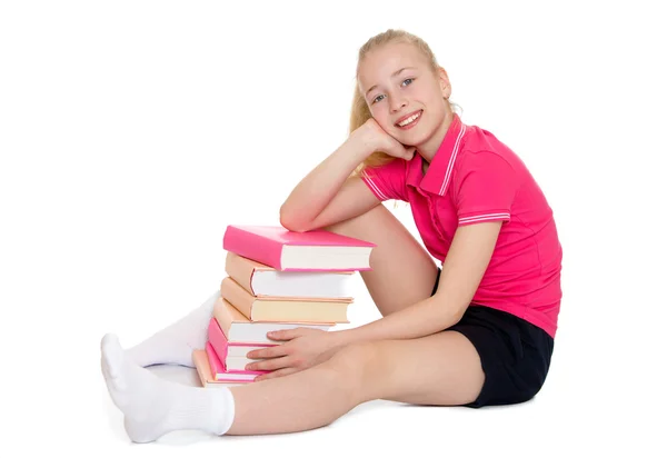 Güzel sarışın kız öğrenci kitapların bir yığınına sarılma — Stok fotoğraf