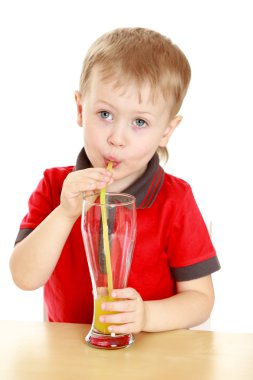 Beautiful blond boy drank through a straw big glass of juice, si clipart