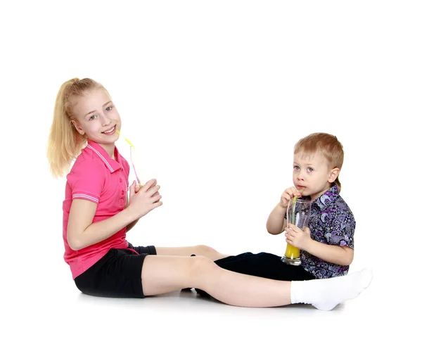 Brother and sister sitting — Stock Photo, Image