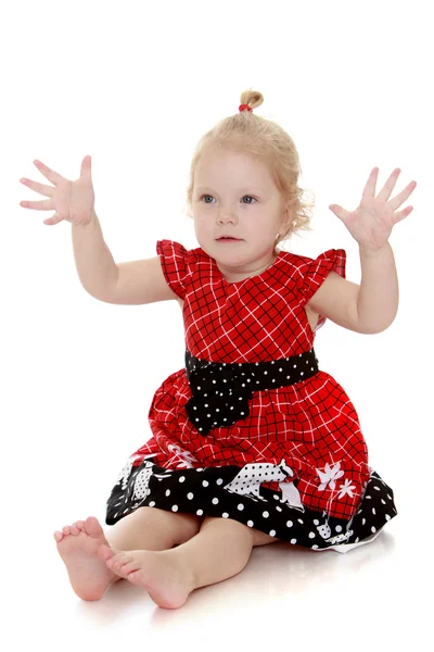 Beautiful blonde very little girl led on the floor with bare fee — Stock Photo, Image