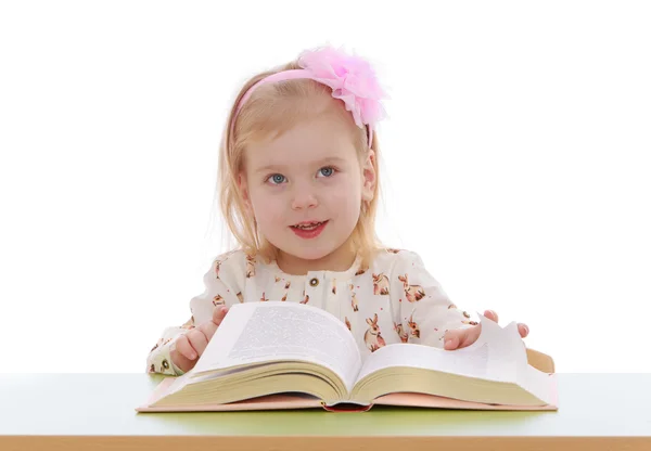 Little blonde girl with a bow — Stock Photo, Image