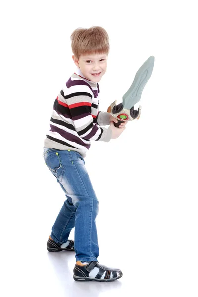 Funny little boy with a toy sword in hand — Stock Photo, Image