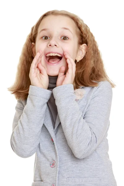 Teenage girl yells loudly putting her hands to face — Stock Photo, Image