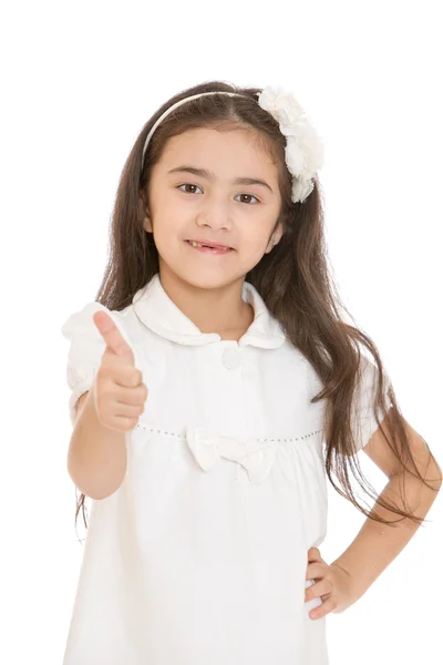 Charmante petite fille aux cheveux bruns poussé sa main avec un rais Images De Stock Libres De Droits